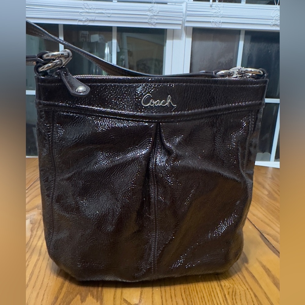 Coach Dark Brown Leather bag NOTE: this bags material is sticky on the outside.